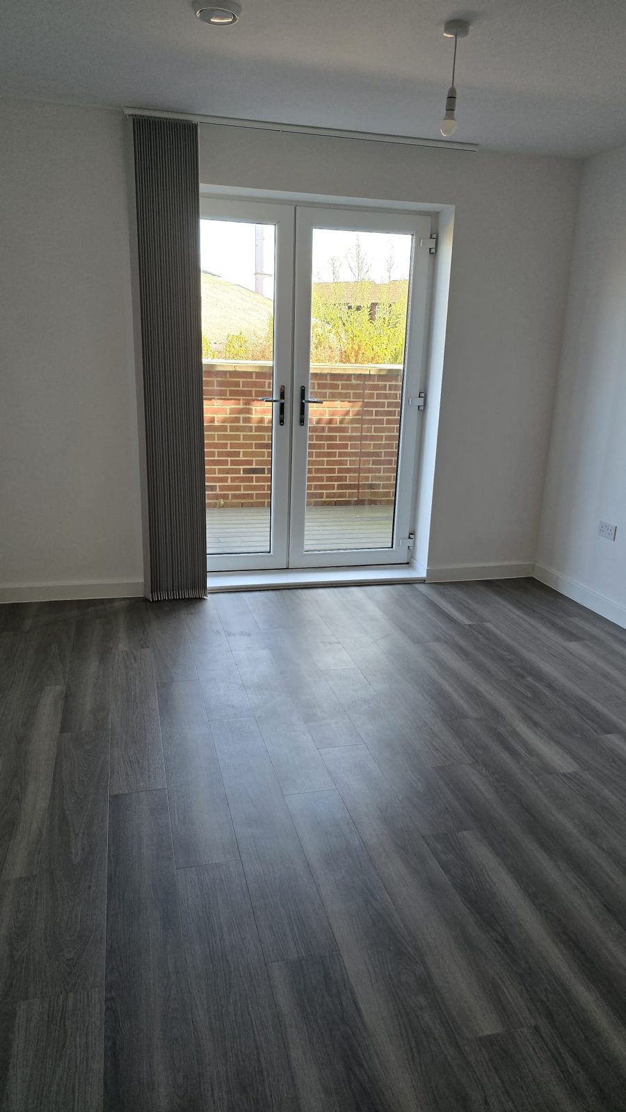 Bedroom with french doors cleaned and empty ready for handover