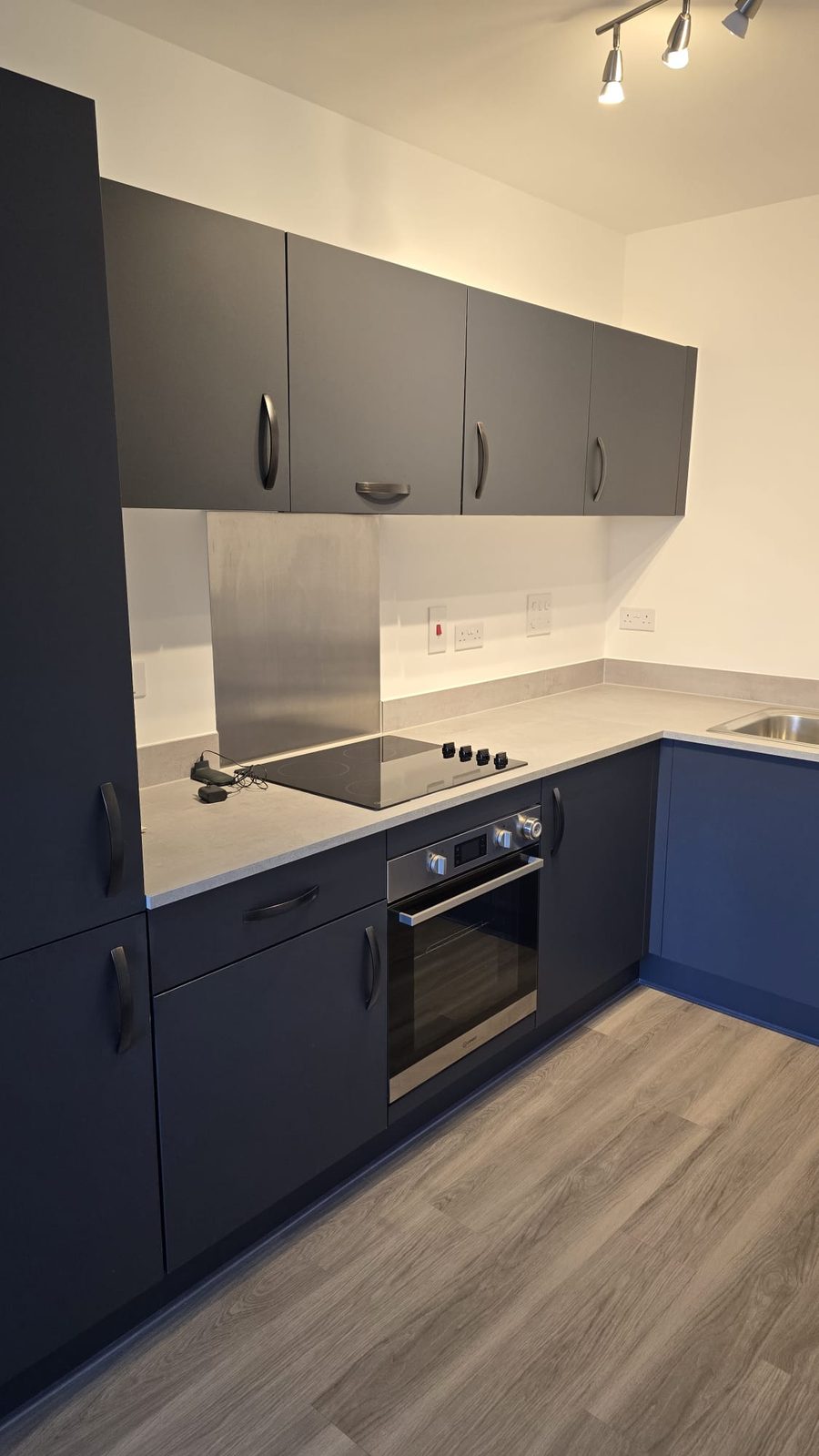 Navy fitted kitchen cleaned and ready for handover