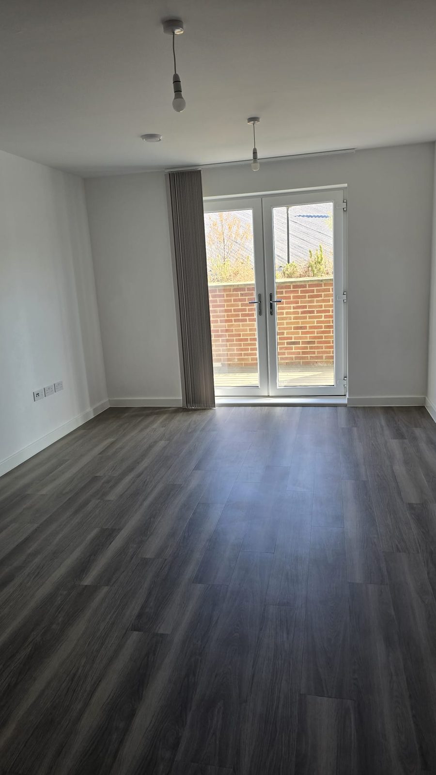 Living room with french doors after an end of tenancy clean