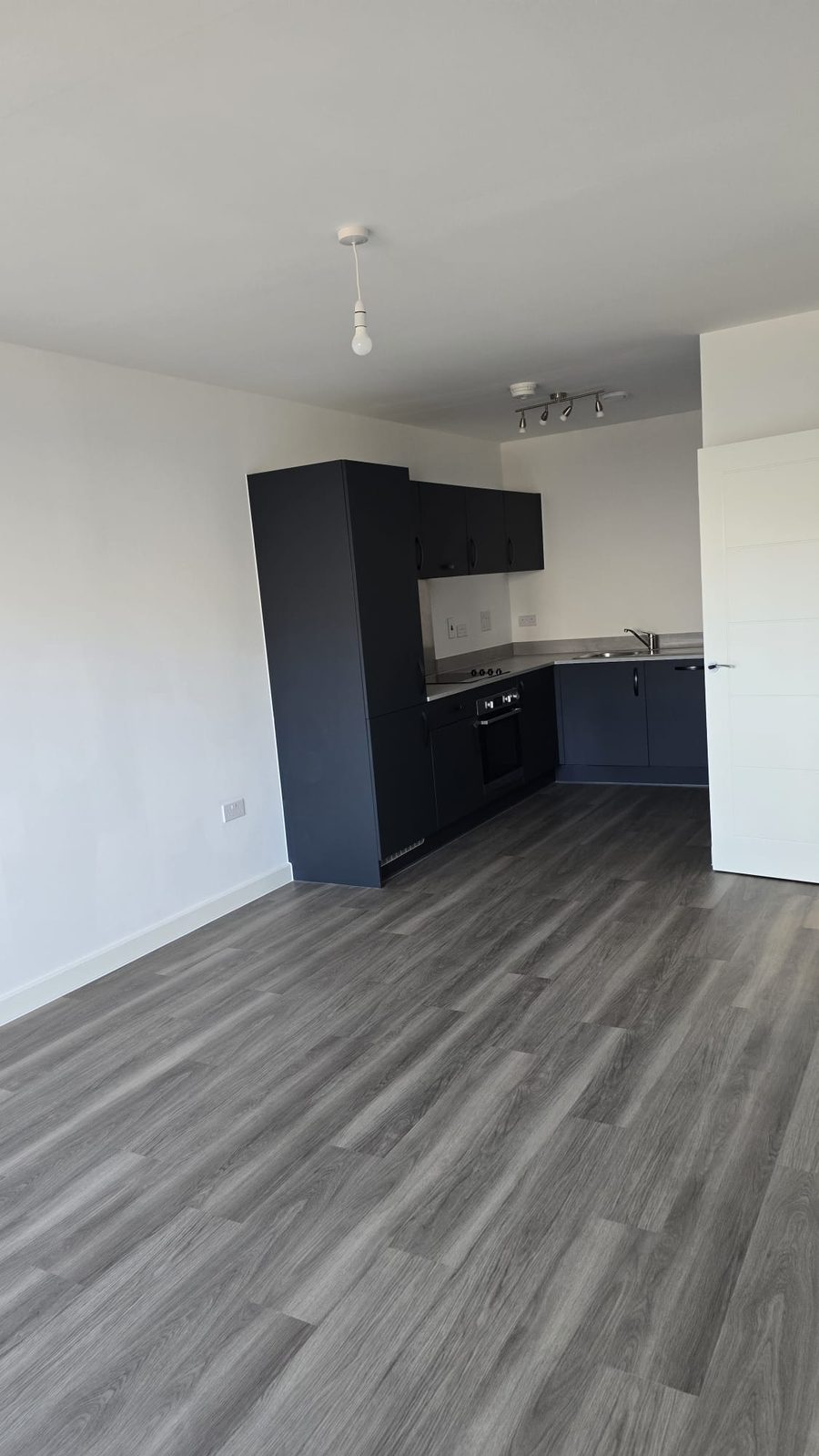 Open plan kitchen and living area cleaned throughout